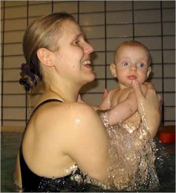 We didn't dunk Molli today, but at different times both Trine and I took to plunging Molli in the water up to her chin then lifting her up out of the water altogether like this, which she seemed to enjoy.  I'm astonished at how good my little Canon A70 is... get a load of the water beads frozen in time!